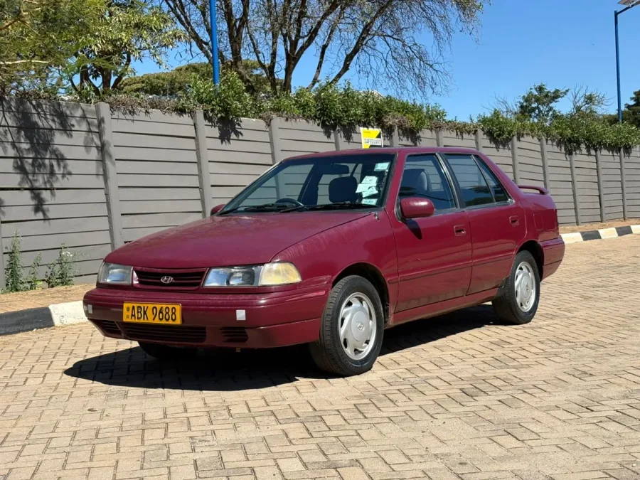 Hyundai Excel, 1998 Model, Mileage @ 156.000km, 1.5 LS Petrol Engine, Manual Trans, Fabric Interior, Alloy Wheels, Ruby Red Colour, Good Condition