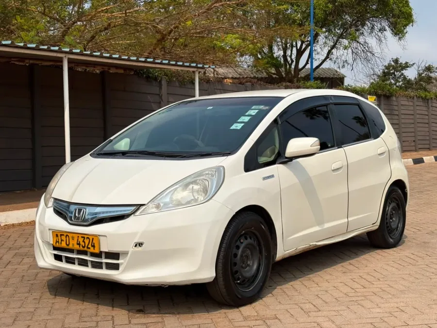 Honda Fit GP1 Hybrid, 2012 Model, Mileage @ 166,000km, Automatic, Neat Fabric Interior, White Colour