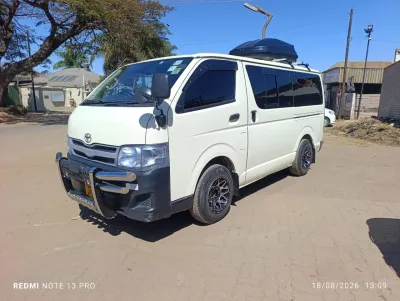 Toyota Hiace 2015 - White panel van with roof box, 194,820 km