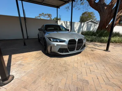 2025 BMW M3 Competition xDrive - Skyscraper Grey / Fiona Red - 3,000km
