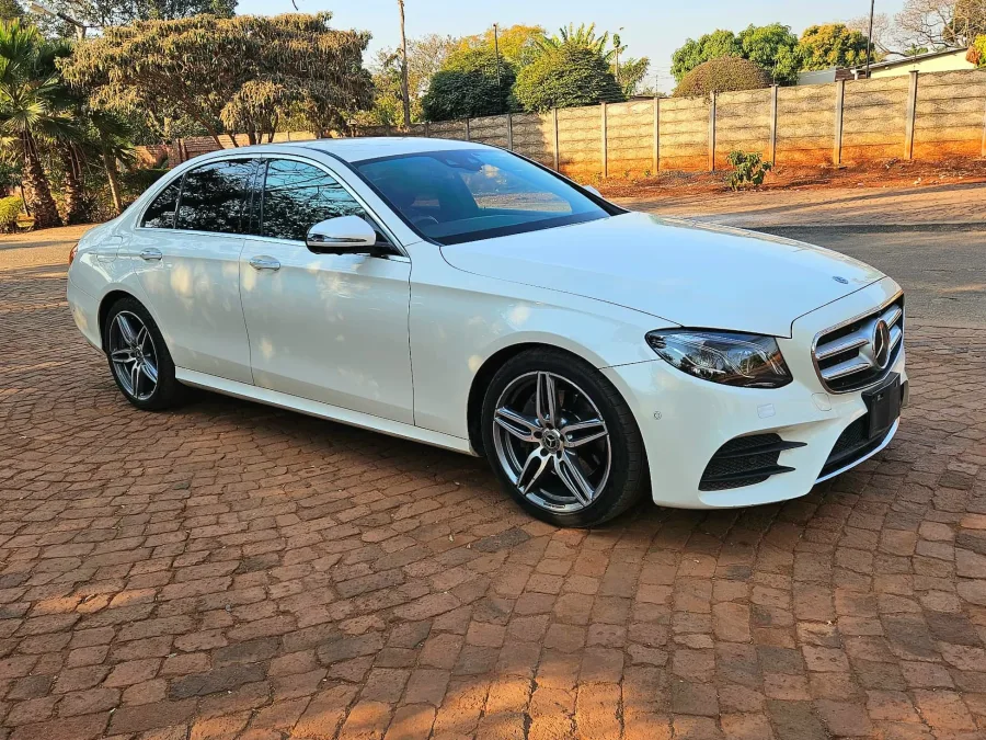 2019 Mercedes-Benz E220d AMG sedan, white, 103,000 km